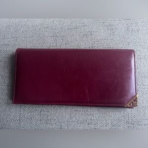 Givenchy Burgundy leather long bifold wallet with gold accents